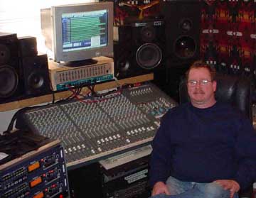 David Henderson Sitting In Front Of Recording Equipment